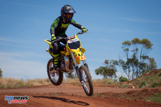 Man riding dirt bike field - a dirt bike free wallpaper