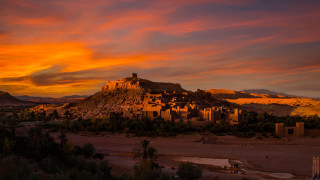 Sunset village desert mountains red - farid mansour free wallpaper