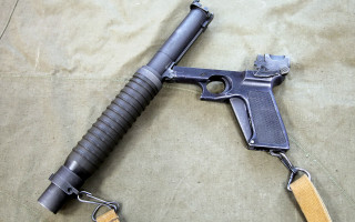 Gun wooden handle metal barrel - a cord free wallpaper