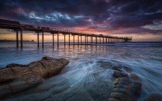 Pier sunset ocean waves rock - a long pier free wallpaper