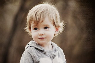 Young boy gray hoodie serious - free portrait wallpaper