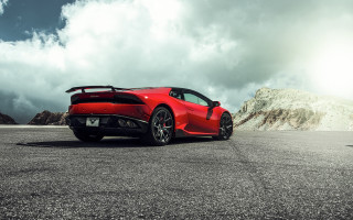 Red sports car mountains clouds 10 - a parking lot free wallpaper