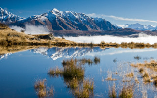 Mountain lake grass bushes clouds - grass and bushes free wallpaper