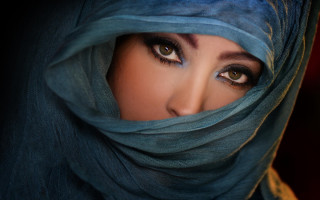 Serious woman blue scarf eyes - a blue scarf free wallpaper