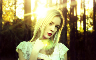 Woman white dress yellow flower 2 - a forest in the background free wallpaper