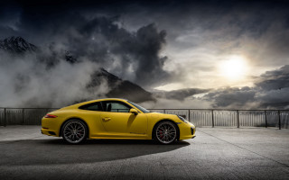 Yellow sports car mountain cloudy - a cloudy sky above free wallpaper