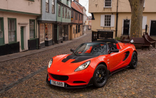 Red sports car cobblestone town - adam szentpétery free wallpaper