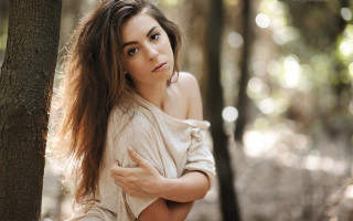 Woman woods serious brown hair - flowing free wallpaper