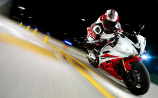 Motorcycle rider city street night - motion free wallpaper
