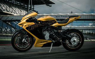 Yellow motorcycle race track stadium - a yellow motorcycle free wallpaper