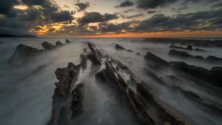 Sunset ocean rocks cloudy sky 9 - widescreen free wallpaper for desktop