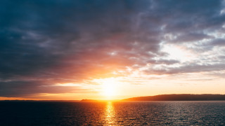 Sunset water mountain boat clouds 2 - anamorphic len free wallpaper for desktop