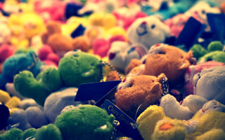 Stuffed animals table top bokeh - a table top free wallpaper