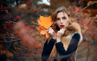 Woman holding leaf autumn fire - a character portrait free wallpaper