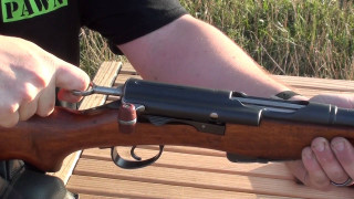 Man holding gun bench woods - 30mm free wallpaper