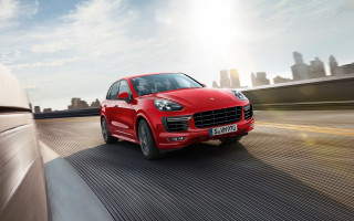 Red porsche cayenne city street - a city street free wallpaper