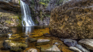 Waterfall rock forest mountain nature - a large rock in the middle of it free wallpaper