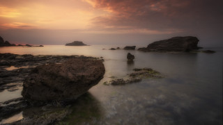 Rocky beach large rock cloudy 2 - a large rock in the middle of it free wallpaper