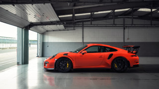 Bright orange porsche garage jigsaw - a large window free wallpaper for desktop