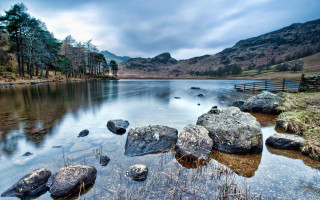 Lake rocks bench mountains clouds - andrew geddes free wallpaper for desktop