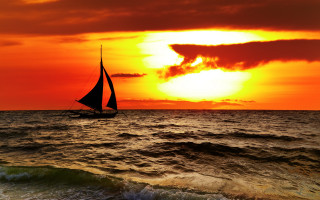 Sailboat ocean sunset clouds horizon 2 - a sailboat free wallpaper for desktop