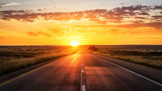 Sunset road grass field mountain - a long road free wallpaper