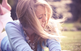 Woman blowing hair cellphone portrait - constance copeman free wallpaper