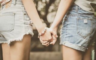 Interlocked hands romanticism blurry closeup - their hands in free wallpaper