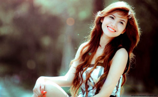 Woman smiling bench long hair - a picture free wallpaper