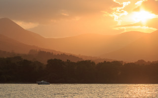 Sunset mountain river boat clouds - the water near a mountain range free wallpaper