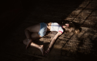 Woman laying white shirt blue - arthouse free wallpaper