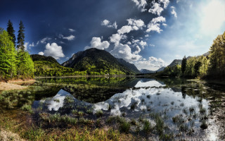 Lake mountains trees cloudy sky 24 - a forest below free wallpaper