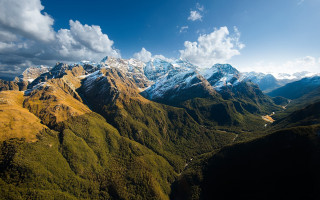 Mountain range valley river clouds - a valley below free wallpaper