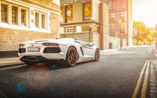 White sports car street cityscape - the side of a street next free wallpaper