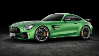 Green mercedes sports car dark - a black background behind free wallpaper