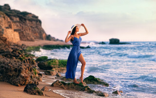 Woman blue dress rock ocean 2 - daphne mcclure free wallpaper