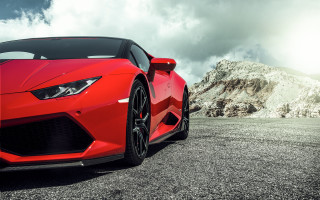 Red sports car mountains clouds - face free wallpaper