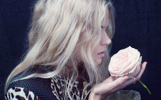 Woman flower serious profile fashion - her face and shoulder free wallpaper