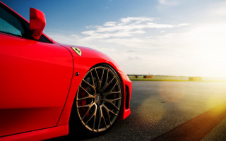 Red sports car sunshine blue - shining free wallpaper