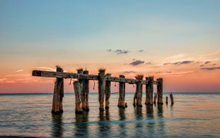 Wooden pier sunset water clouds - a wooden pier free wallpaper