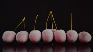 Pink fruit row black surface - a row free wallpaper