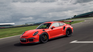 Red sports car race track 6 - a green grass field free wallpaper