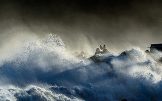 Stormy lighthouse wave people building - a large wave free wallpaper