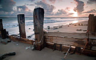 Wooden fence beach sunset waves - the water behind free wallpaper