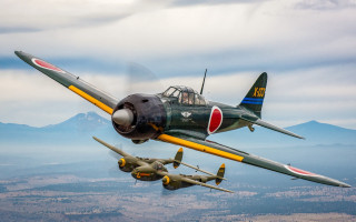 Planes mountains clouds sky puzzle - a propeller plane free wallpaper