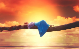 Woman lying wooden pole over - dreamlike free wallpaper