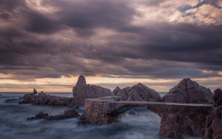 Bridge water rocks cloudy sky - stormy weather free wallpaper