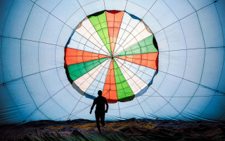 Man parachute fence rooftop tiles - christo free wallpaper