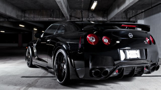 Black sports car parking garage 13 - the rear end of the car free wallpaper