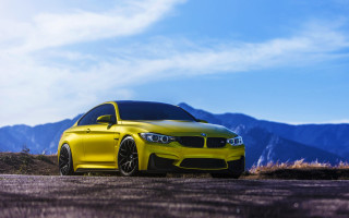 Yellow car mountains road forest - a yellow car free wallpaper